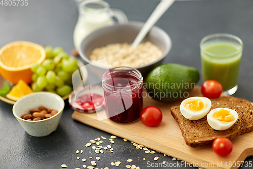 Image of jam, toast bread, eggs, avocado, cherry tomatoes