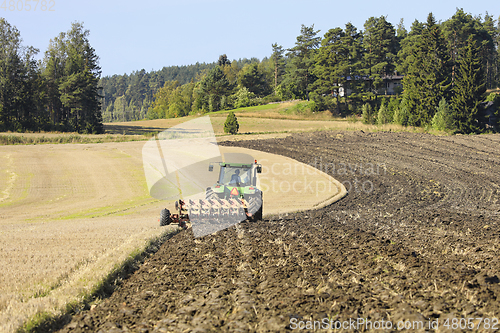 Image of Tractor and Plough in Field