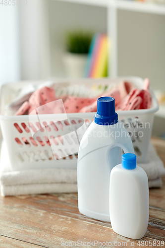 Image of baby clothes in laundry basket with detergent