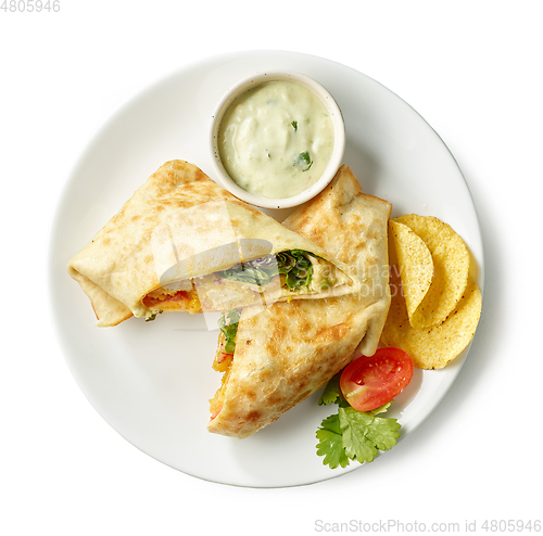 Image of tortilla with fried chicken and vegetables