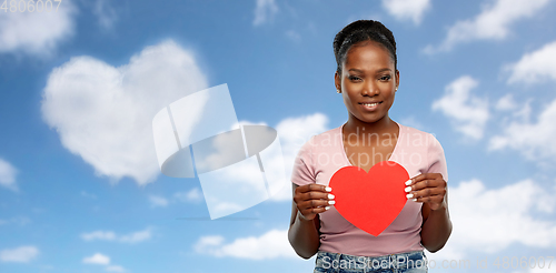 Image of happy african american woman with red heart