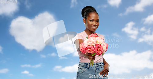 Image of happy african american woman with bunch of flowers