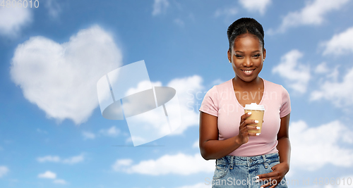 Image of happy african american woman drinking coffee