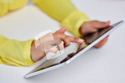 Image of hands of african american woman with tablet pc