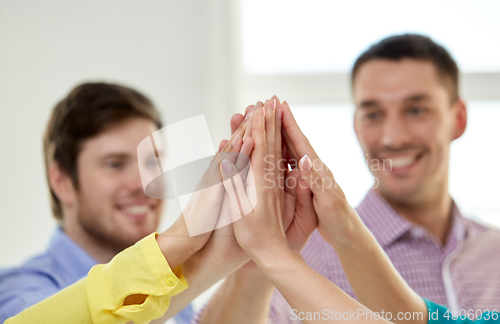 Image of happy smiling students making high five