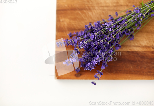 Image of bunch of lavender flowers on wooden board