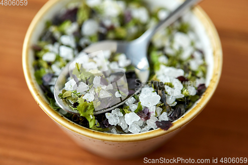 Image of close up of flavored sea salt in bowl with spoon