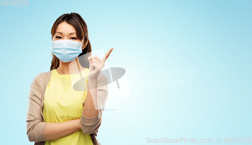 Image of asian young woman in protective medical mask