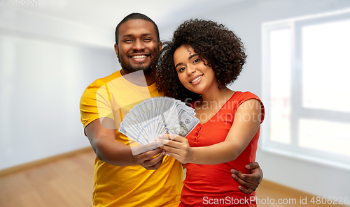 Image of african american couple with money at new home