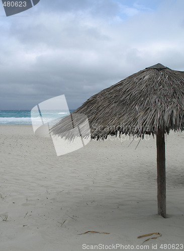 Image of parasol on the empty beach