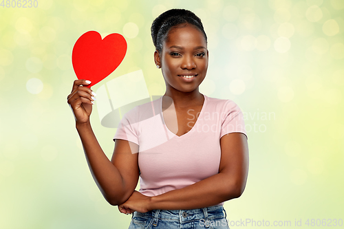 Image of happy african american woman with red heart