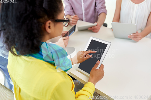 Image of group of high school students with tablet pc