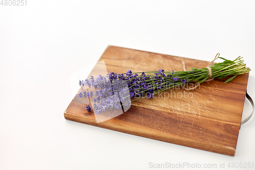 Image of bunch of lavender flowers on wooden board