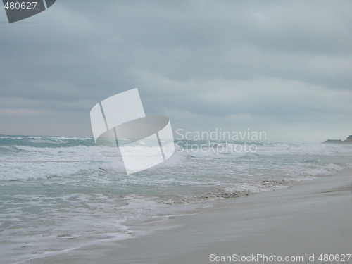 Image of turquoise tropical ocean and dark sky