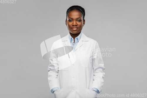 Image of happy african american female doctor or scientist