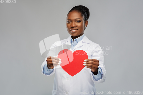 Image of african american female doctor with red heart