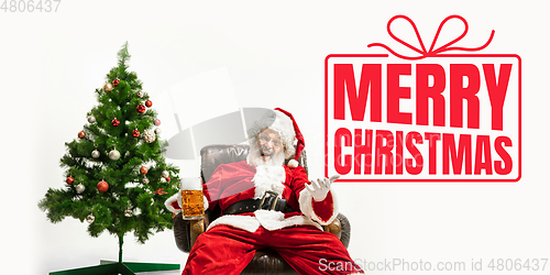 Image of Santa Claus wishing happy New Year and Merry Christmas