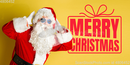 Image of Santa Claus wishing happy New Year and Merry Christmas