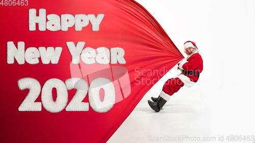 Image of Santa Claus wishing happy New Year and Merry Christmas