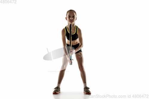 Image of Little caucasian girl playing tennis isolated on white background