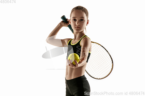 Image of Little caucasian girl playing tennis isolated on white background