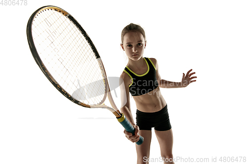 Image of Little caucasian girl playing tennis isolated on white background