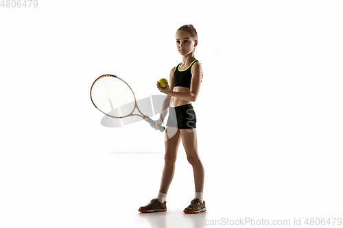 Image of Little caucasian girl playing tennis isolated on white background