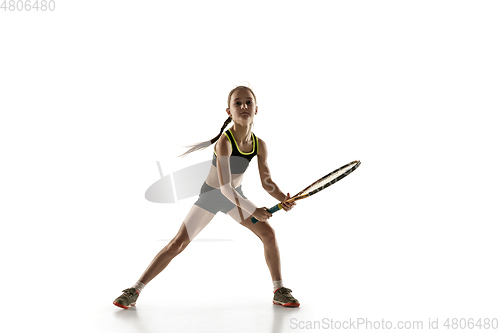 Image of Little caucasian girl playing tennis isolated on white background