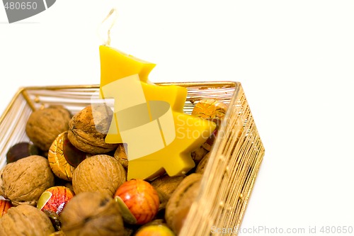 Image of walnuts, sweets and handmade candle