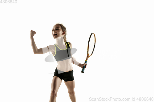 Image of Little caucasian girl playing tennis isolated on white background