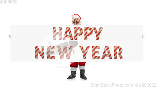 Image of Santa Claus wishing happy New Year and Merry Christmas