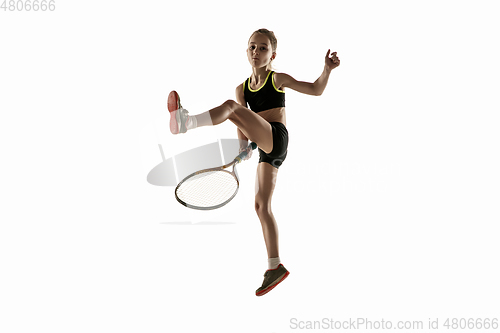 Image of Little caucasian girl playing tennis isolated on white background
