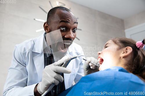 Image of Young caucasian girl visiting dentist\'s office