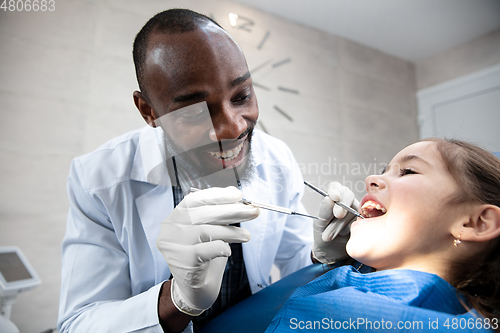 Image of Young caucasian girl visiting dentist\'s office