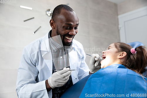 Image of Young caucasian girl visiting dentist\'s office