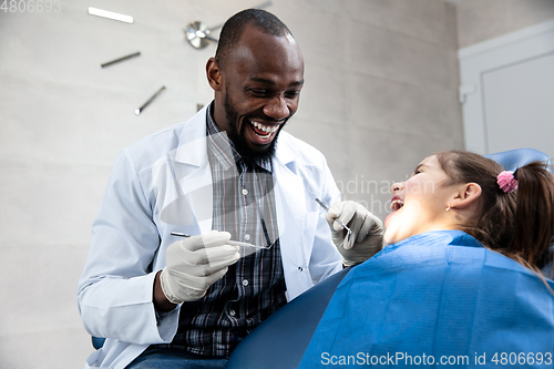 Image of Young caucasian girl visiting dentist\'s office