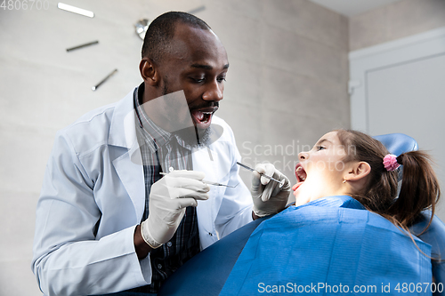 Image of Young caucasian girl visiting dentist\'s office