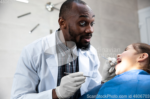 Image of Young caucasian girl visiting dentist\'s office