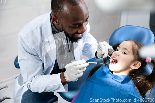 Image of Young caucasian girl visiting dentist\'s office