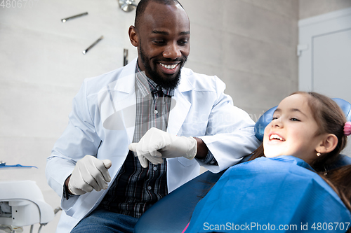 Image of Young caucasian girl visiting dentist\'s office