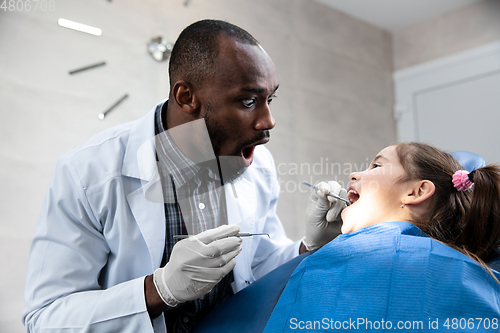 Image of Young caucasian girl visiting dentist\'s office