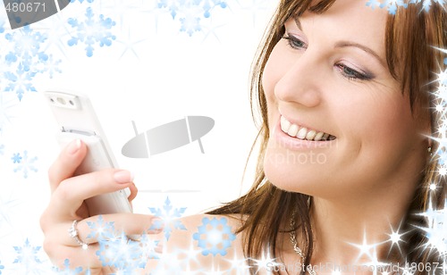 Image of happy woman with white phone