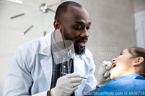 Image of Young caucasian girl visiting dentist\'s office