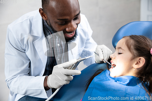 Image of Young caucasian girl visiting dentist\'s office