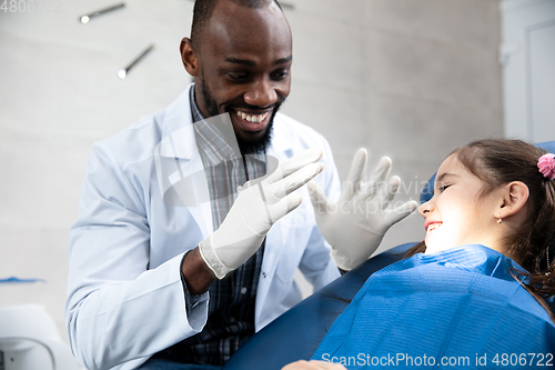 Image of Young caucasian girl visiting dentist\'s office