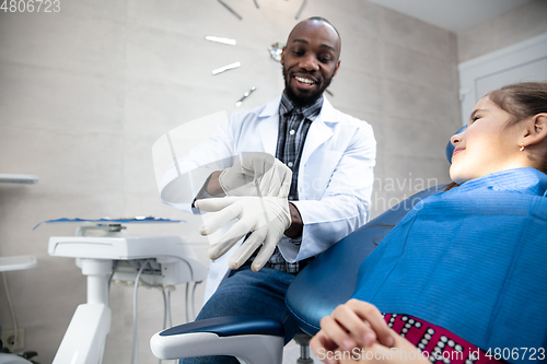 Image of Young caucasian girl visiting dentist\'s office