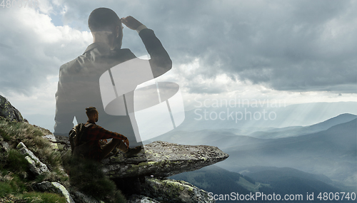 Image of Silhouette of businessman with landscapes on background, double exposure.