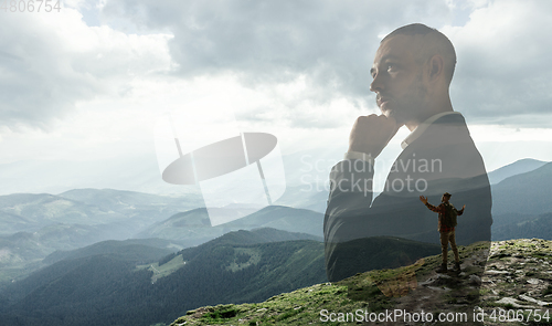 Image of Silhouette of businessman with landscapes on background, double exposure.