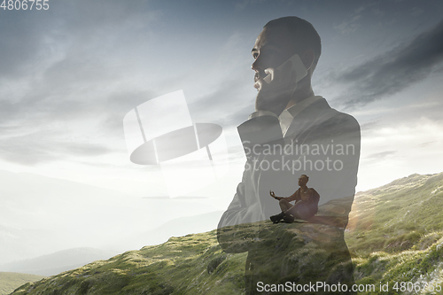 Image of Silhouette of businessman with landscapes on background, double exposure.