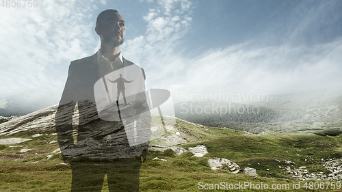 Image of Silhouette of businessman with landscapes on background, double exposure.